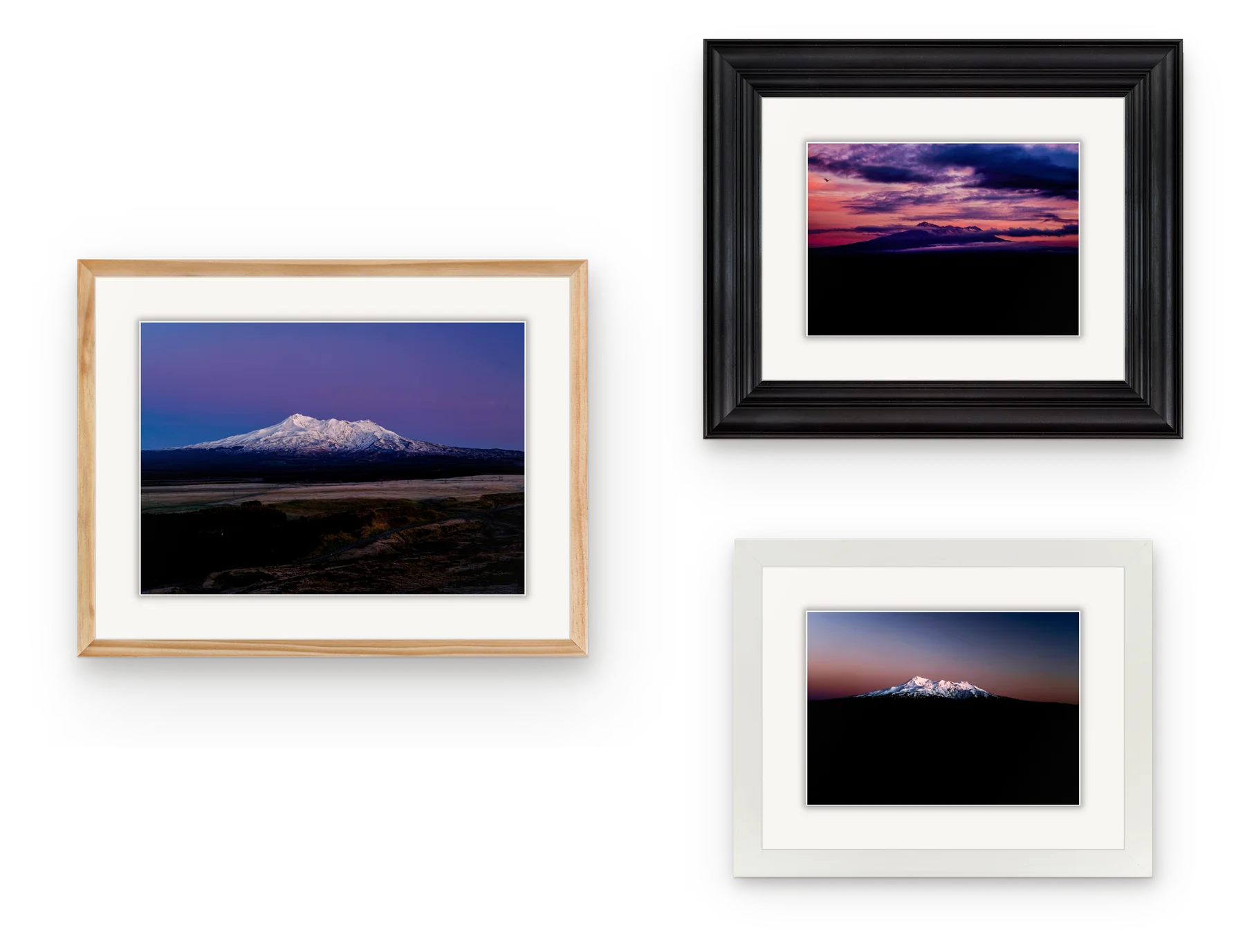 Three framed photographs of Ruapehu hung together, in natural wood, black and white frames.