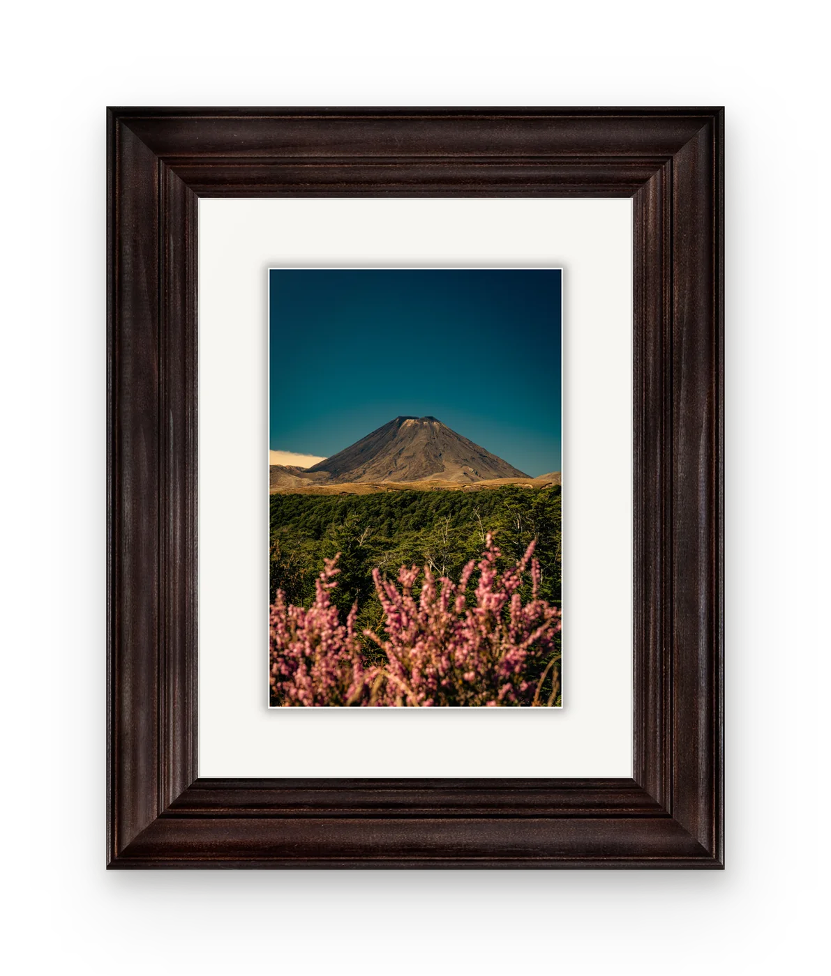 Mount Ngauruhoe with pink heather in the foreground, framed in dark walnut with a white mat.